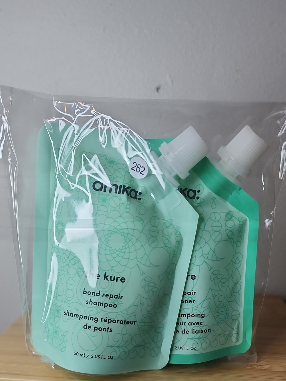 amika mint-green The Kure Bond Repair Shampoo & Conditioner Duo